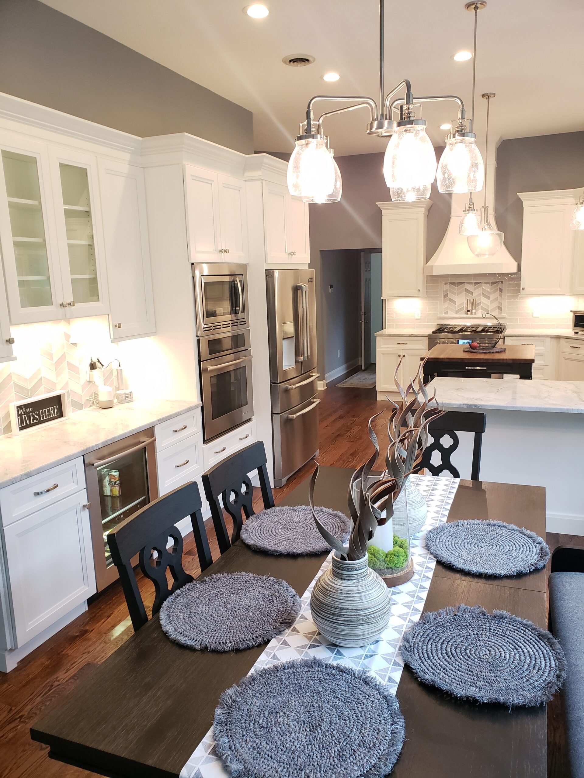 Bright open-concept kitchen with dining area and modern chairs