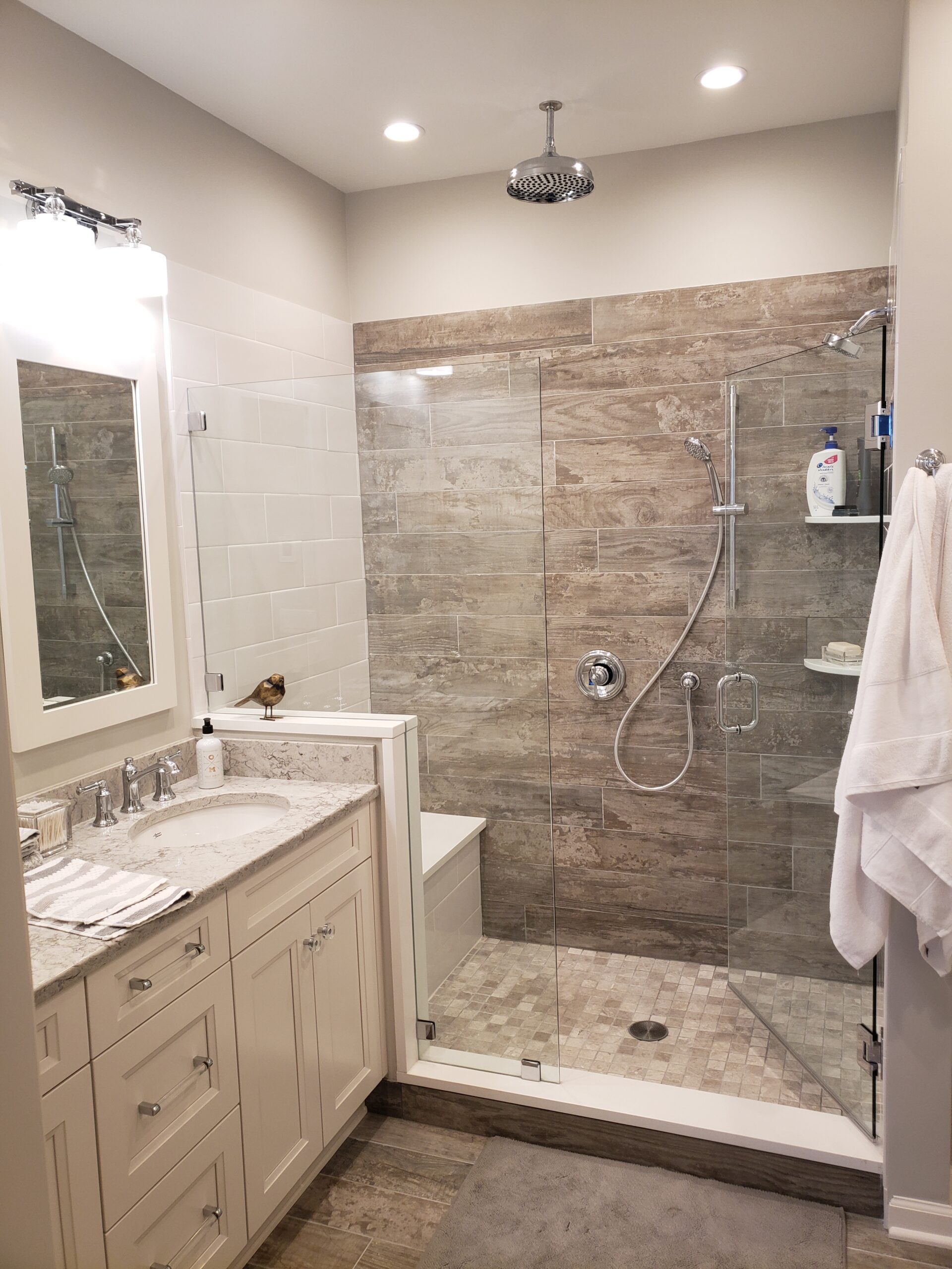 Elegant bathroom with marble tiles and rainfall showerhead