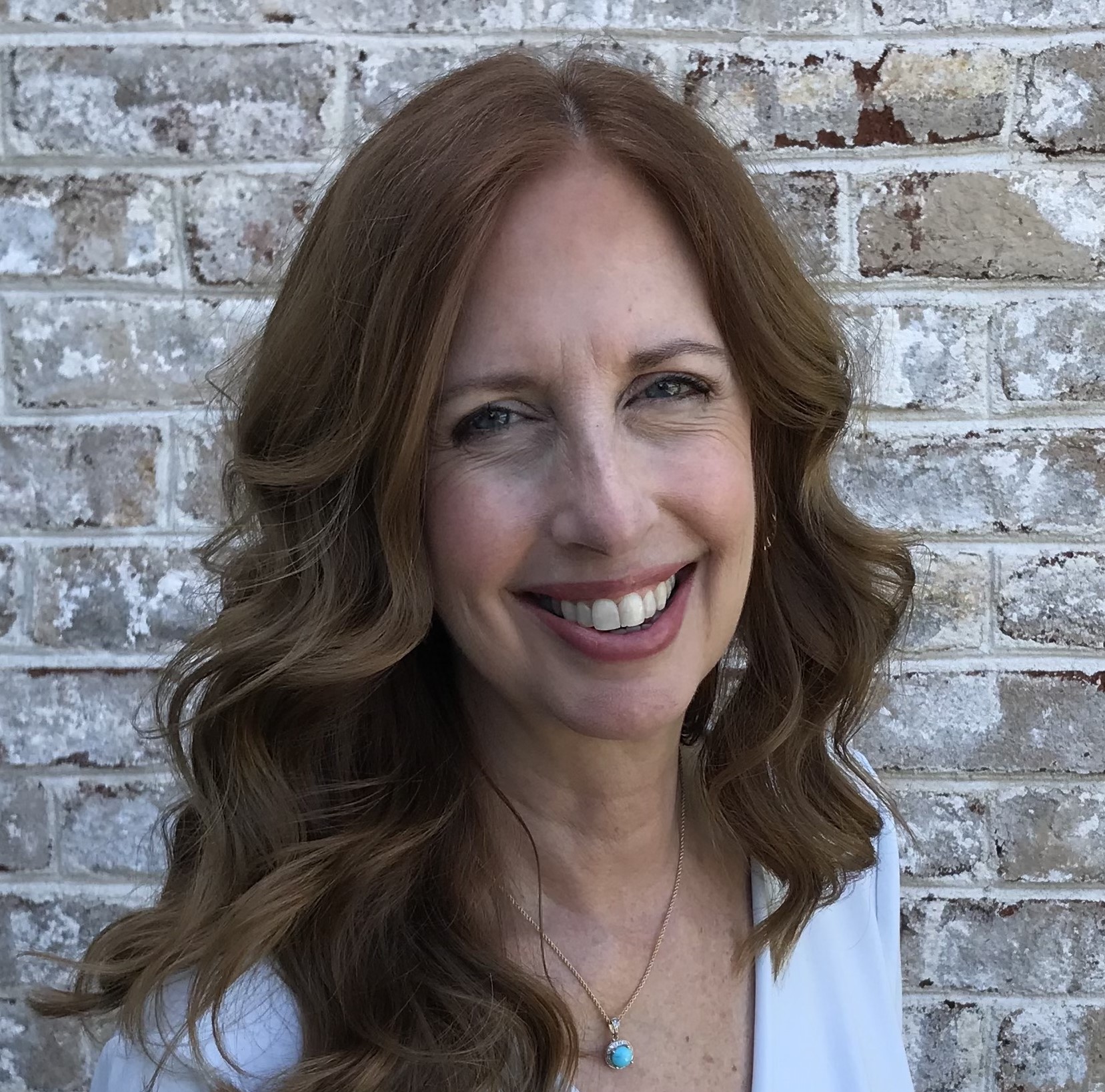 Portrait of female team member smiling at camera — All Trades Contracting